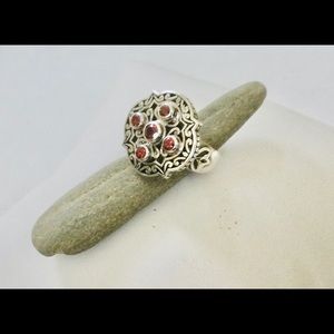 Janice Girardi, sterling silver, garnet ring.